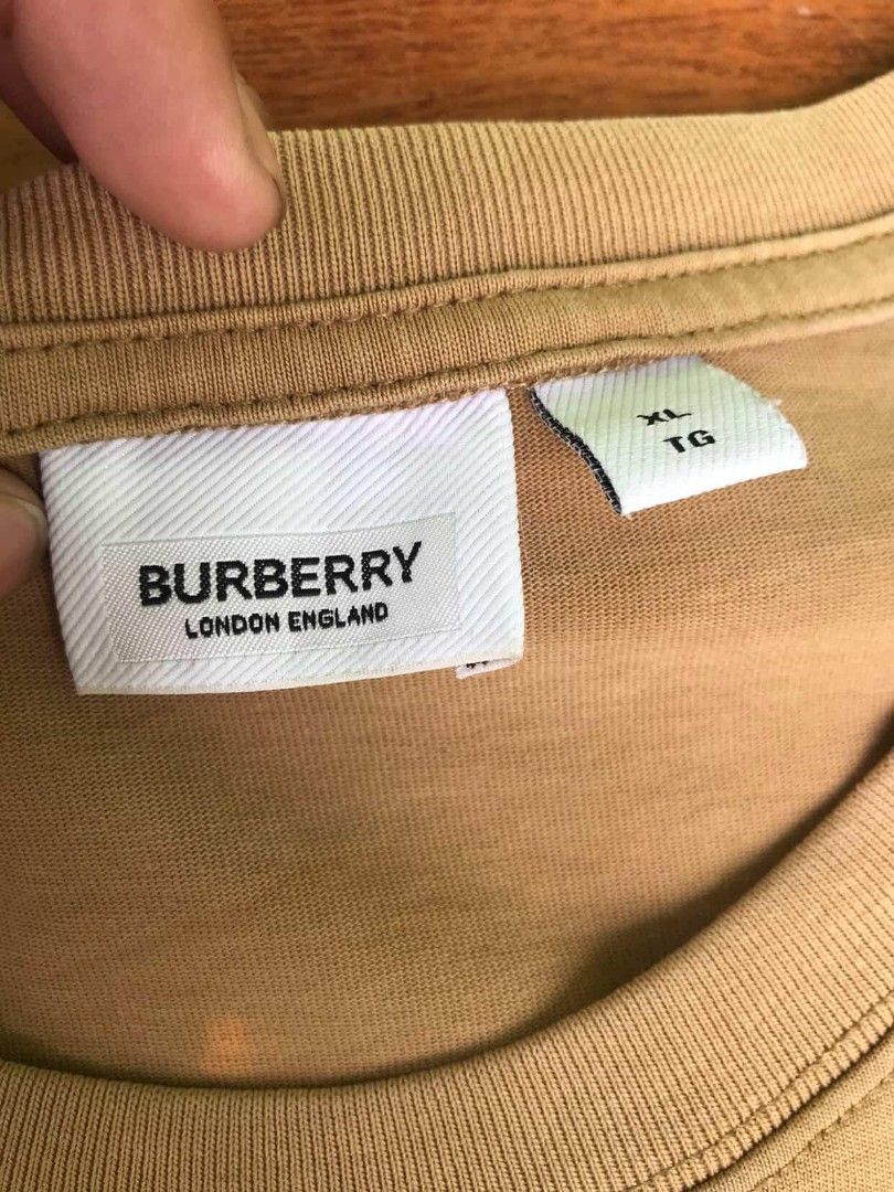 Burberry Knight Graphic Tee XL (Category: Tshirts & Polo Shirts ) located in Manila. Submitted by ronmark (Listing ID 1423212106, Image 3). Description: - Burberry T-shirt - Features a knight graphic - Color: Tan - Size: XL - Crew neck and short sleeves - Made in London, England.