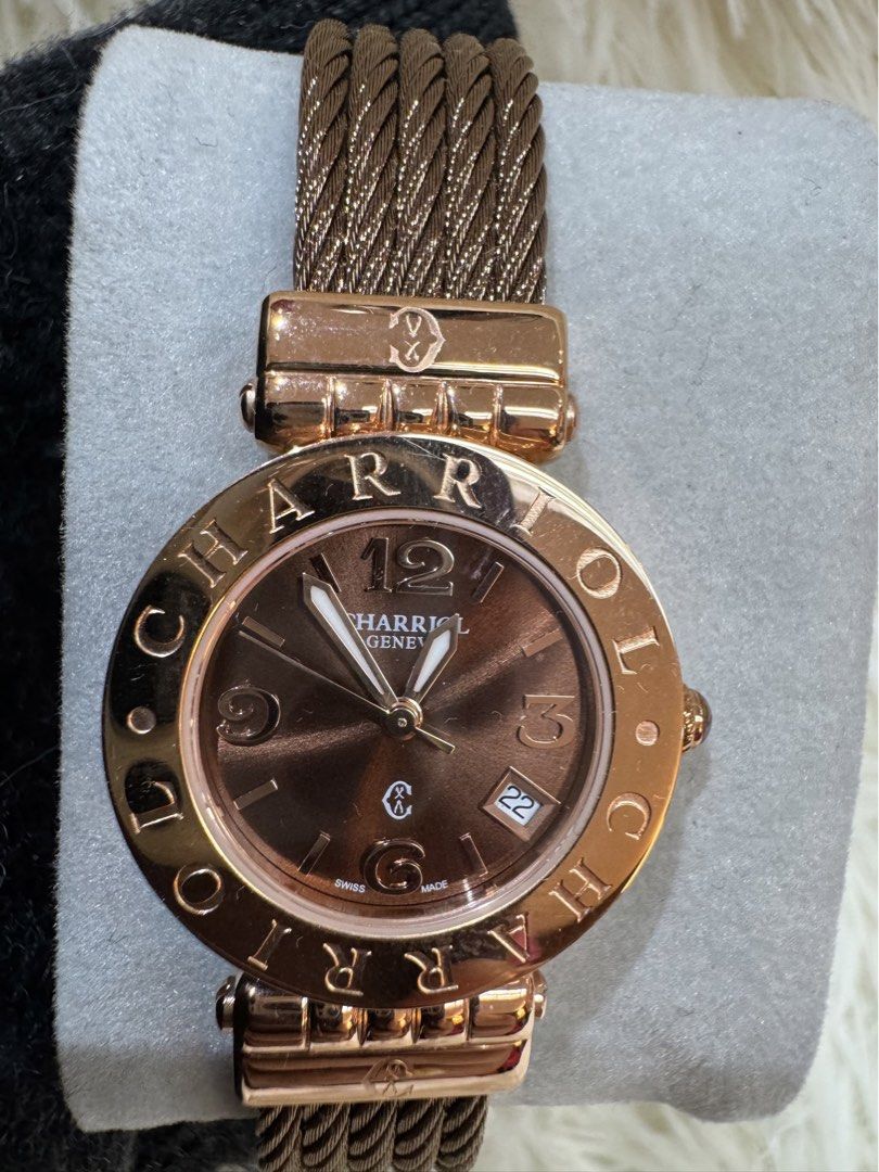 Charriol St. Tropez Brown Dial Watch (Category: Luxury Watches) located in Manila. Submitted by chloe_luxuries (Listing ID 1423186976, Image 2). Description: - Charriol St. Tropez watch - Brown dial - Rose gold-tone bezel - Unique cable bracelet - Date display at 3 o'clock - Stainless steel clasp - Charriol logo on the back -comes with box.