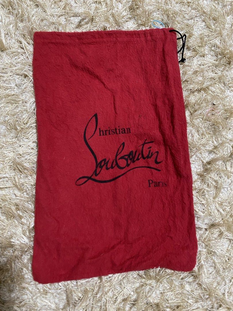 Christian Louboutin Dust Bag (Category: Luxury Bags & Wallets) located in Manila. Submitted by avathriftedcloset (Listing ID 1423186754, Image 1). Description: - Authentic Christian Louboutin dust bag - Features the brand's logo in black - Red color - Drawstring closure - Protects your Louboutin shoes and accessories - Perfect for any Louboutin owner.