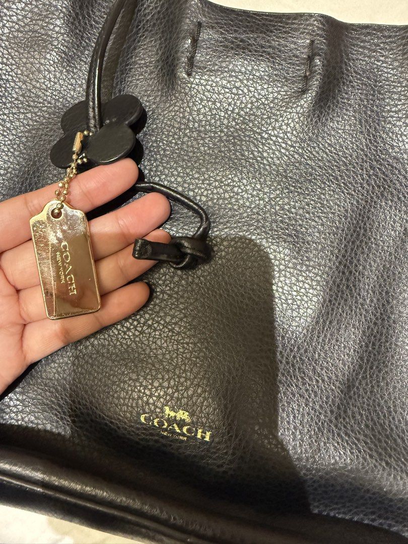 Coach Black Crossbody Bag (Category: Luxury Bags & Wallets) located in Taguig. Submitted by slay.ph (Listing ID 1423115442, Image 3). Description: - Black Coach crossbody bag - Drawstring closure - Long strap for shoulder/crossbody wear - Includes Coach tag - Made of leather - Brown interior - Simple, elegant design - Perfect for everyday use.