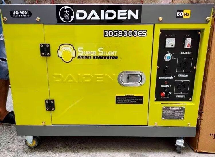 Daiden DDG8000ES Super Silent Diesel Generator (Category: Construction Tools & Equipment) located in Caloocan City. Submitted by electronicsandappliances1 (Listing ID 1423252310, Image 1). Description: Daiden DDG8000ES Super Silent Diesel Generator. Features a 60 Hz frequency. Includes AC outlets and a volt meter. The generator is designed for quiet operation. The control panel includes various indicators and switches. The unit is mounted on whee