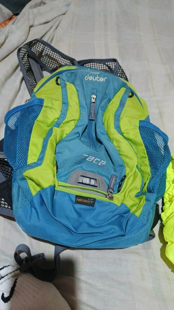 Deuter Race Backpack with Rain Cover (Category: Backpacks) located in Bacoor. Submitted by punkzappa18 (Listing ID 1423187364, Image 3). Description: - Deuter Race backpack preloved still in good condition 900 pesos only - Blue and green color scheme - Zippered main compartment - Mesh side pockets - Includes bright yellow rain cover - Adjustable straps - Ideal for hiking, cycling, or everyday use Fixed price Cavite city police location for pick u