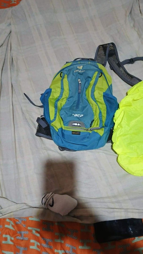 Deuter Race Backpack with Rain Cover (Category: Backpacks) located in Bacoor. Submitted by punkzappa18 (Listing ID 1423187364, Image 1). Description: - Deuter Race backpack preloved still in good condition 900 pesos only - Blue and green color scheme - Zippered main compartment - Mesh side pockets - Includes bright yellow rain cover - Adjustable straps - Ideal for hiking, cycling, or everyday use Fixed price Cavite city police location for pick u