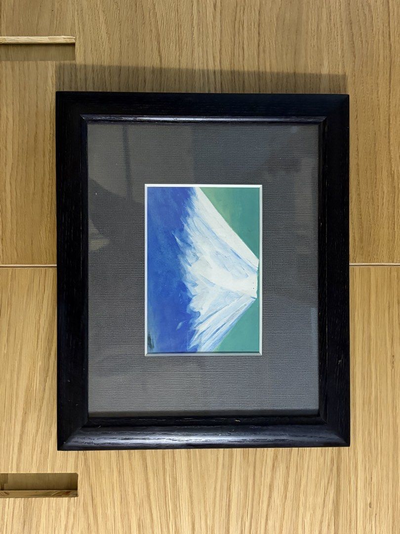 Framed Abstract Painting (Category: Art & Prints) located in Manila. Submitted by arelsnts (Listing ID 1423168273, Image 1). Description: - Framed abstract painting - Features a blue and white design - Set against a green background - Comes in a black frame - Ready to hang - Perfect for any room.