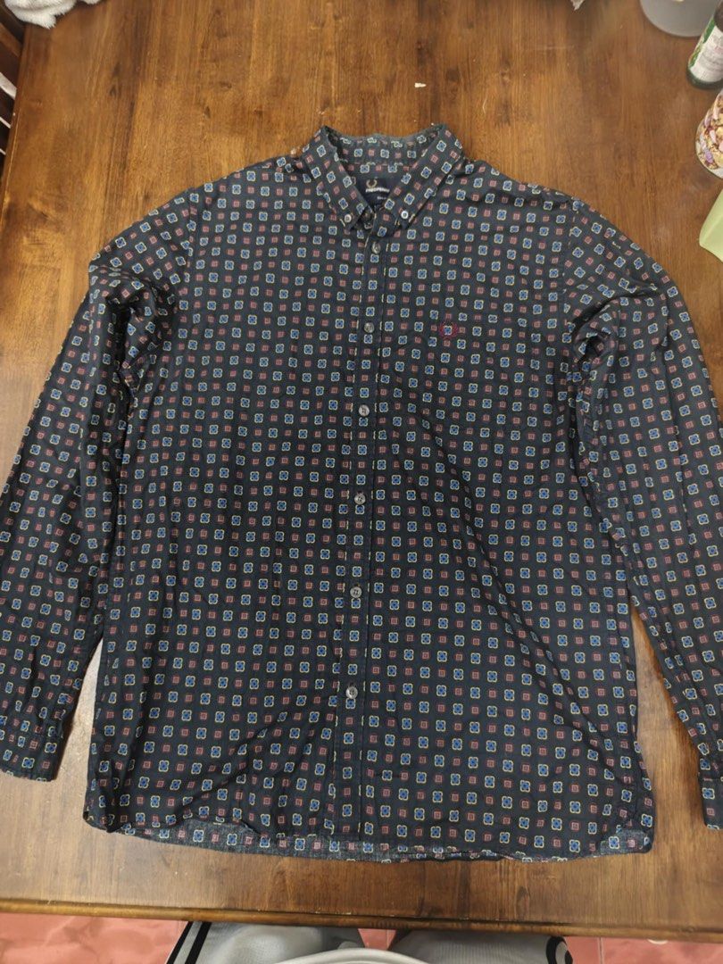 Fred Perry Long Sleeve Shirt - L (Category: Tshirts & Polo Shirts ) located in Manila. Submitted by jtg199x (Listing ID 1423146859, Image 1). Description: - Fred Perry long sleeve shirt - Unique geometric pattern - Button-down collar - Iconic Fred Perry logo - Dark base color with blue, red, and yellow squares - Size: L, slim fit - Made in China - Includes Fred Perry label.
