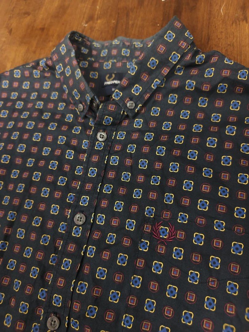 Fred Perry Long Sleeve Shirt - L (Category: Tshirts & Polo Shirts ) located in Manila. Submitted by jtg199x (Listing ID 1423146859, Image 2). Description: - Fred Perry long sleeve shirt - Unique geometric pattern - Button-down collar - Iconic Fred Perry logo - Dark base color with blue, red, and yellow squares - Size: L, slim fit - Made in China - Includes Fred Perry label.