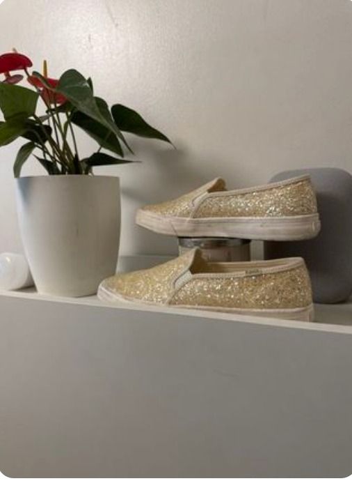 Glitter Slip-on Shoes (Category: Sneakers) located in San Juan City. Submitted by simpleperfection (Listing ID 1423258412, Image 1). Description: Gold glitter slip-on shoes. Features a white sole and a rounded toe. Perfect for adding a touch of sparkle to any outfit. Comfortable and easy to wear, these shoes are a stylish choice for casual occasions..