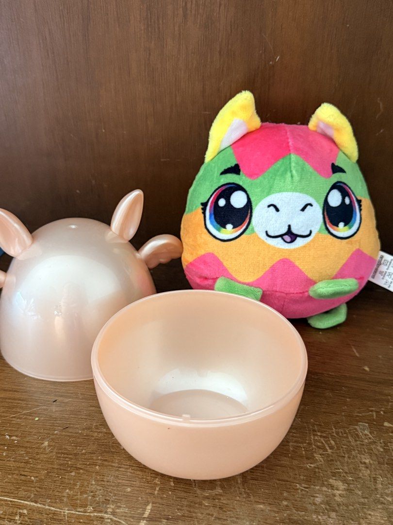 Honeydew Tales Plush Toy (Category: Plushies & Soft Toys) located in San Juan City. Submitted by findmephilippines (Listing ID 1423101007, Image 2). Description: - Honeydew Tales Llama Plush Toy - Includes a pink egg-shaped container - Made of 100% polyester - Batch Code: PT240731 - Manufactured in Dongguan, China - Features a vibrant color scheme with rainbow eyes.