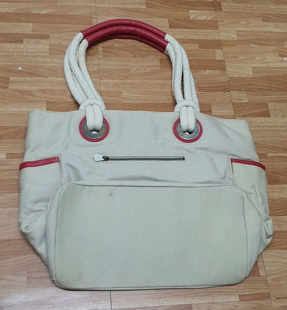 Hunter Canvas Beach Bag (Category: Tote Bags) located in Manila. Submitted by apoltree (Listing ID 1423190916, Image 3). Description: - Hunter beach bag - Beige canvas with red accents - Rope handles with red leather detailing - Drawstring closure - Interior pockets - Two exterior pockets - Hunter tag attached - Beige interior lining - Heavy and sturdy canvas cloth Brand new, unused, stored hence the stain on the interior lining..