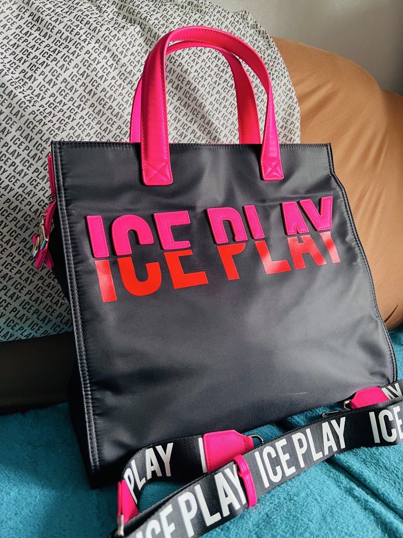 Ice Play Tote Bag with Shoulder Strap (Category: Tote Bags) located in Taguig. Submitted by Zyannah (Listing ID 1423096299, Image 2). Description: - Preloved Ice Play nylon tote bag - Black exterior with pink accents - Detachable shoulder strap with brand name - Zippered closure - Spacious interior - Includes dust bag and tags - Perfect for everyday use - MOP: BDO or GCash - MOS: Lalamove, Grab or J&T - Bought in Moscow Note: Except as expressly 