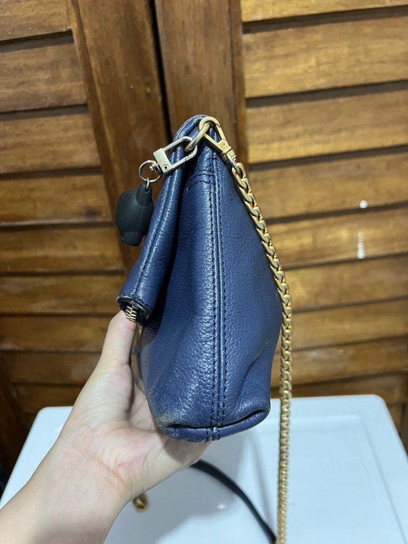 Jill Stuart Navy Blue Chain Bag (Category: Luxury Bags & Wallets) located in Tacloban City. Submitted by classy_luxury (Listing ID 1423158247, Image 2). Description: - Navy blue Jill Stuart handbag - Gold chain strap - Fold-over flap with zipper closure - Interior pocket - Gold zipper and hardware - Interior tag with brand name and model number (JA2H SE610-01).