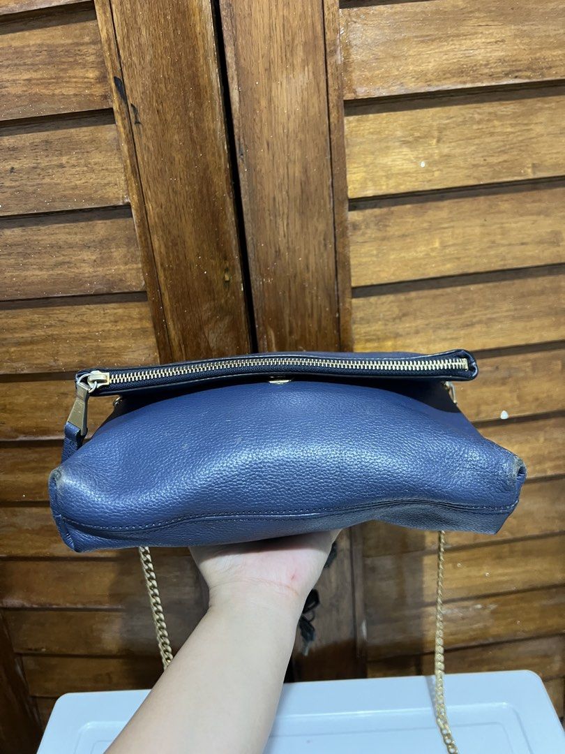 Jill Stuart Navy Blue Chain Bag (Category: Luxury Bags & Wallets) located in Tacloban City. Submitted by classy_luxury (Listing ID 1423158247, Image 3). Description: - Navy blue Jill Stuart handbag - Gold chain strap - Fold-over flap with zipper closure - Interior pocket - Gold zipper and hardware - Interior tag with brand name and model number (JA2H SE610-01).