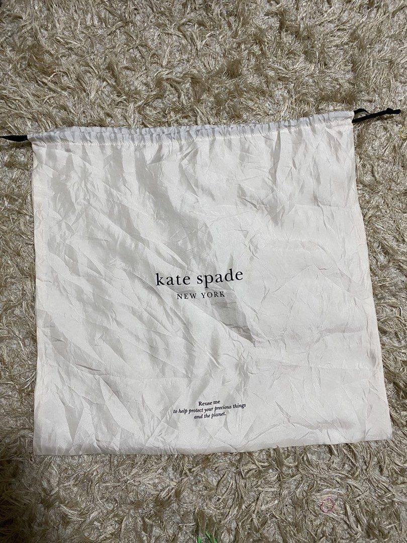 Kate Spade Dust Bag (Category: Luxury Bags & Wallets) located in Manila. Submitted by avathriftedcloset (Listing ID 1423186908, Image 1). Description: - Authentic Kate Spade dust bag - Features the Kate Spade New York logo - Drawstring closure - Color: White - Message: "Reuse me to help protect your precious things and the planet.".