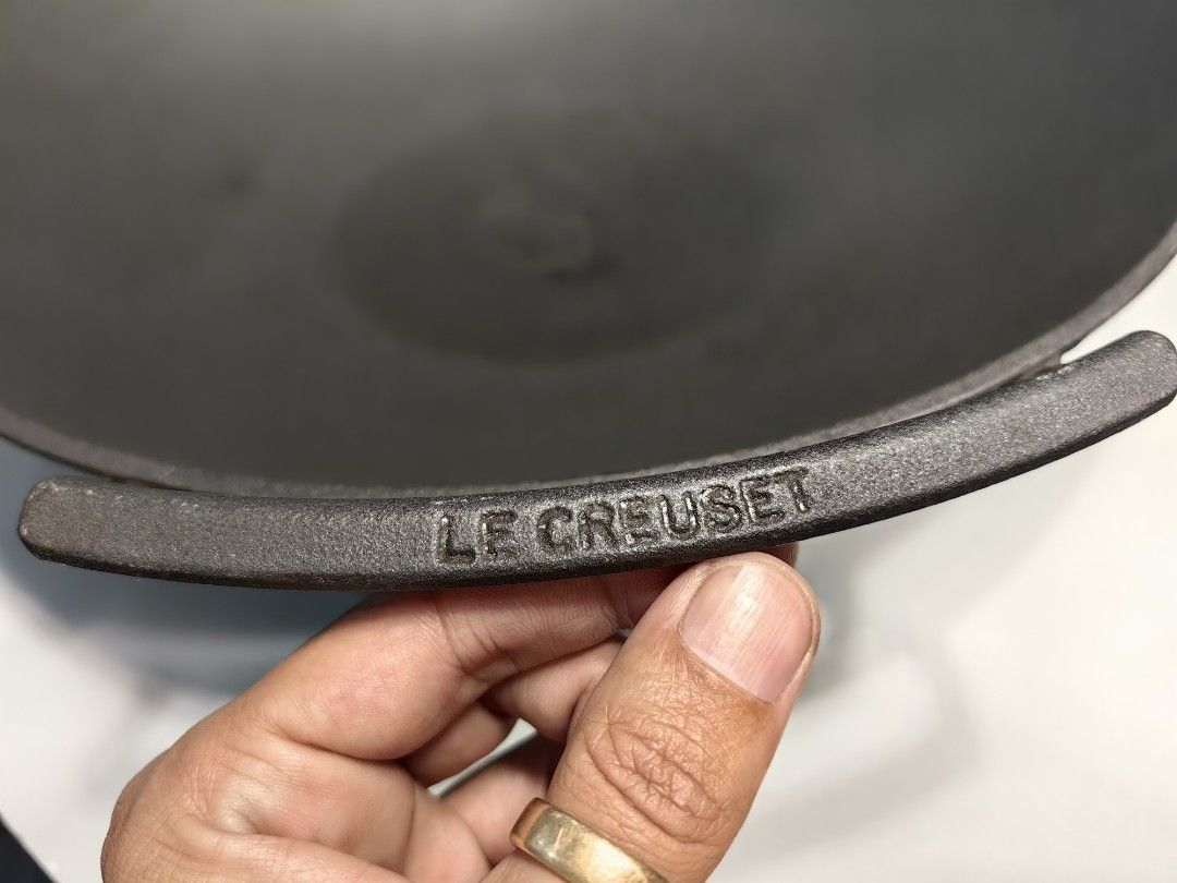Le Creuset Cast Iron Wok (Category: Cookware & Accessories) located in Batangas. Submitted by migoy0210 (Listing ID 1423190686, Image 1). Description: - Authentic Le Creuset cast iron wok - Classic design with two handles - Wide cooking surface - Le Creuset logo visible - Well-maintained condition - Perfect for stir-frying and Asian dishes.