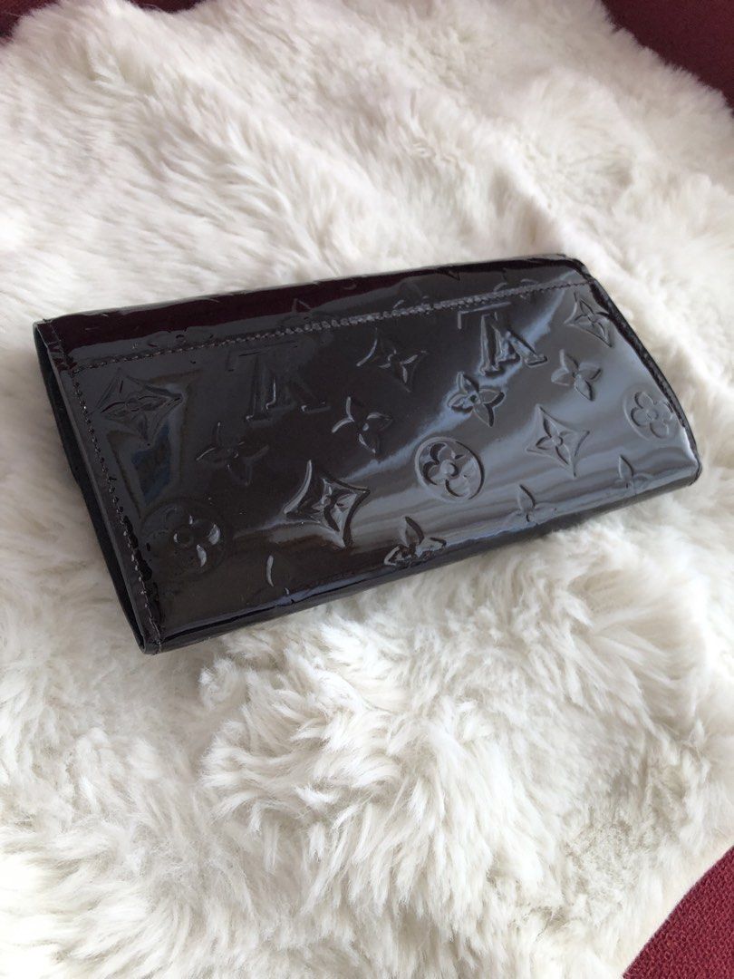 Louis Vuitton Vernis Wallet (Category: Luxury Bags & Wallets) located in Cabuyao City. Submitted by wakahatana (Listing ID 1423099890, Image 2). Description: - Authentic Louis Vuitton Vernis wallet - Glossy dark brown finish - Snap closure - Gold-tone zipper - Multiple card slots - Zippered compartment - Louis Vuitton logo on zipper pull - Made in France.