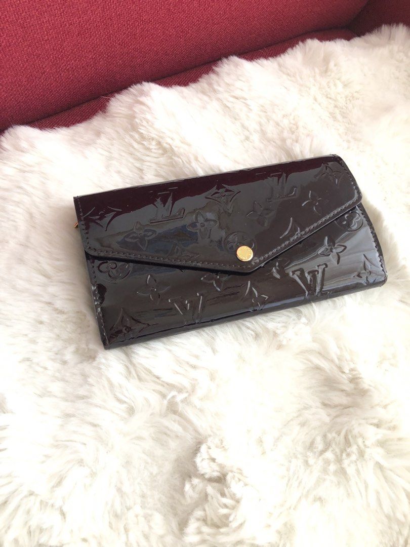 Louis Vuitton Vernis Wallet (Category: Luxury Bags & Wallets) located in Cabuyao City. Submitted by wakahatana (Listing ID 1423099890, Image 1). Description: - Authentic Louis Vuitton Vernis wallet - Glossy dark brown finish - Snap closure - Gold-tone zipper - Multiple card slots - Zippered compartment - Louis Vuitton logo on zipper pull - Made in France.