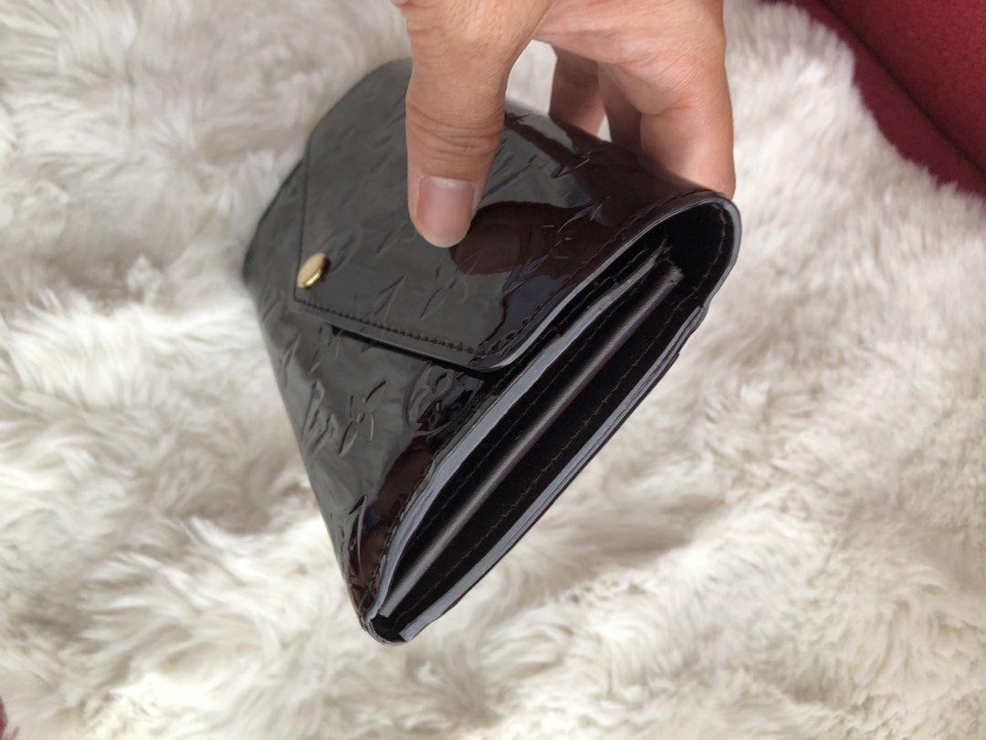 Louis Vuitton Vernis Wallet (Category: Luxury Bags & Wallets) located in Cabuyao City. Submitted by wakahatana (Listing ID 1423099890, Image 3). Description: - Authentic Louis Vuitton Vernis wallet - Glossy dark brown finish - Snap closure - Gold-tone zipper - Multiple card slots - Zippered compartment - Louis Vuitton logo on zipper pull - Made in France.