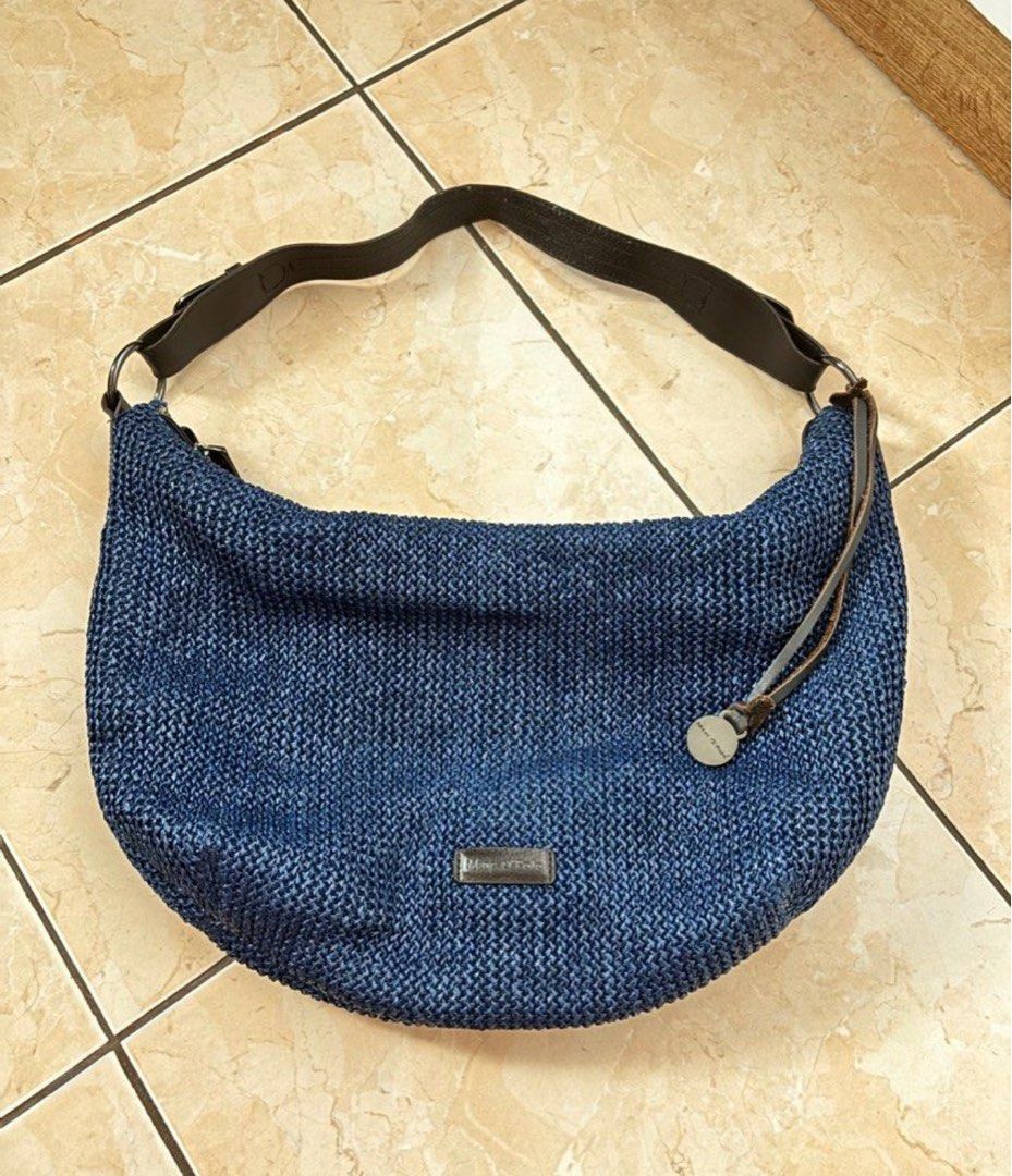 Marc O'Polo Blue Woven Handbag (Category: Luxury Bags & Wallets) located in Silang. Submitted by declutterswuni (Listing ID 1423145828, Image 1). Description: - Marc O'Polo handbag - Woven blue design - Dark brown leather strap - Spacious interior with multiple compartments - Striped interior lining - Zipper closure.
