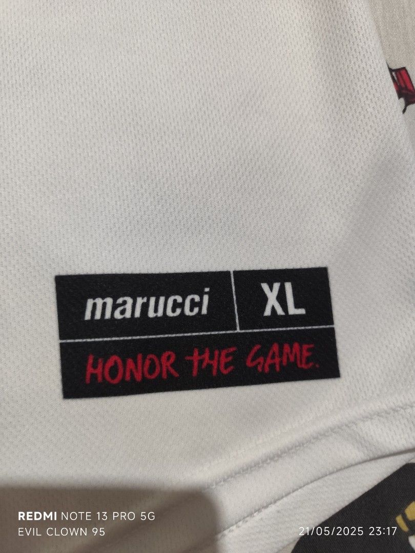 Marucci Hornets Baseball Jersey XL (Category: Tshirts & Polo Shirts ) located in Baguio. Submitted by FRANKLIN (Listing ID 1423160473, Image 2). Description: - Marucci Hornets baseball jersey - Features the number 27 - "Hornets" text on the front - White base with orange accents - Hornets logo on the sleeve - Made of 100% polyester - Size: XL - Measurements: 24.5 x 32.