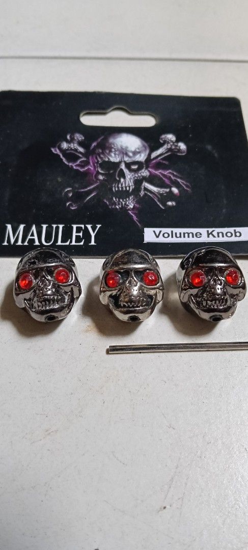 Mauley Skull Volume Knobs (Category: Music Accessories) located in Singapore. Submitted by oldandslowlearner (Listing ID 1423106598, Image 1). Description: Set of three skull-shaped volume knobs by Mauley. Available in silver and gold finishes, both with red eyes. Includes an Allen key for installation. Brand new and sealed. Self collect in Bukit Gombak..