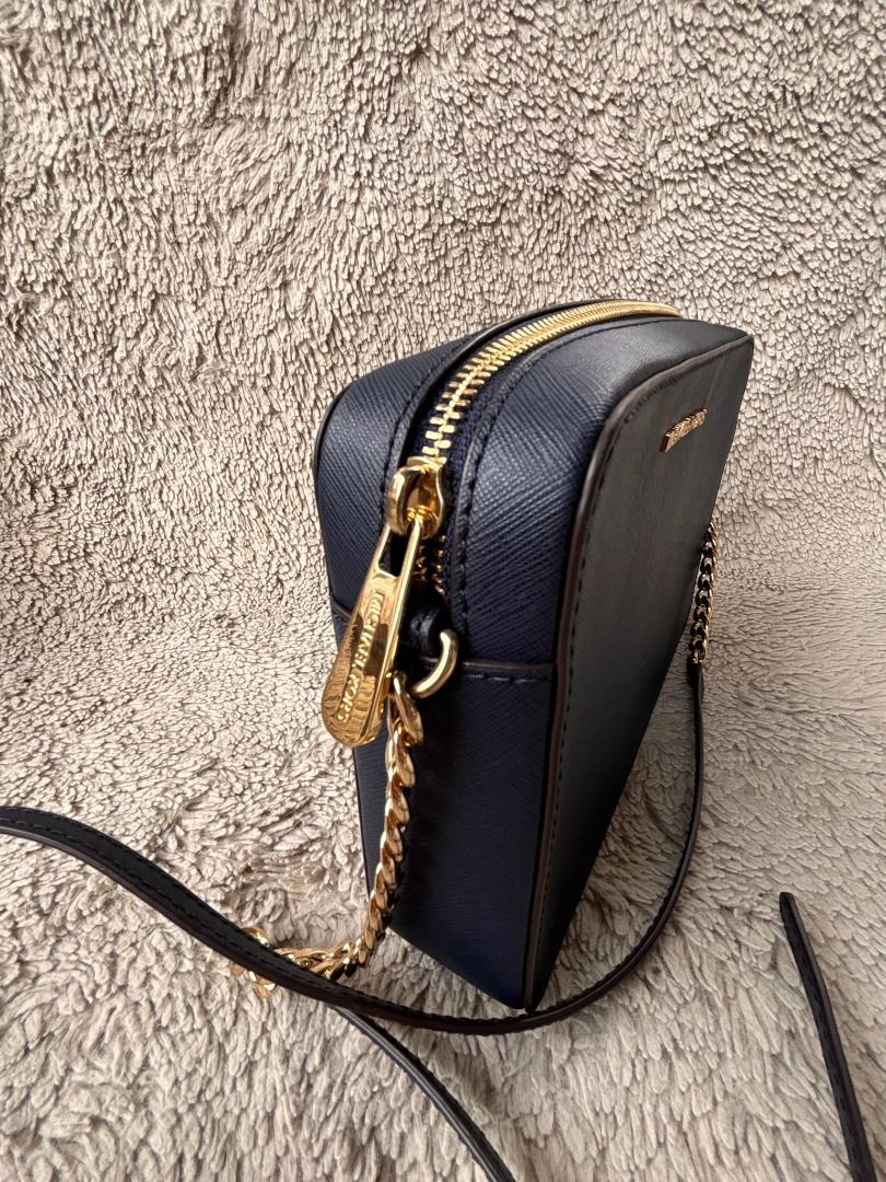 Authentic Michael Kors Navy Blue Crossbody Bag (Category: Luxury Bags & Wallets) located in Caloocan City. Submitted by ginger-feet (Listing ID 1423089171, Image 2). Description: AUTHENTIC M•K• Michael Kors (MK) Jet Set Crossbody bag (Blue) Good condition with tiny stains interior Pre-loved, Japan sourced No box, no dustbag, no card.