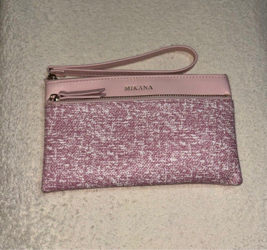 Mikana Wristlet (Koji Pink) (Category: Clutches) located in Silang. Submitted by declutterswuni (Listing ID 1423150655, Image 1). Description: - Mikana pink clutch - Wrist strap included - Secure zipper closure - Interior with multiple compartments - Includes a card holder - Textured front design - Smooth back - Ideal for cards, cash, and keys.