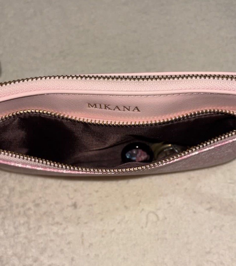 Mikana Wristlet (Koji Pink) (Category: Clutches) located in Silang. Submitted by declutterswuni (Listing ID 1423150655, Image 3). Description: - Mikana pink clutch - Wrist strap included - Secure zipper closure - Interior with multiple compartments - Includes a card holder - Textured front design - Smooth back - Ideal for cards, cash, and keys.