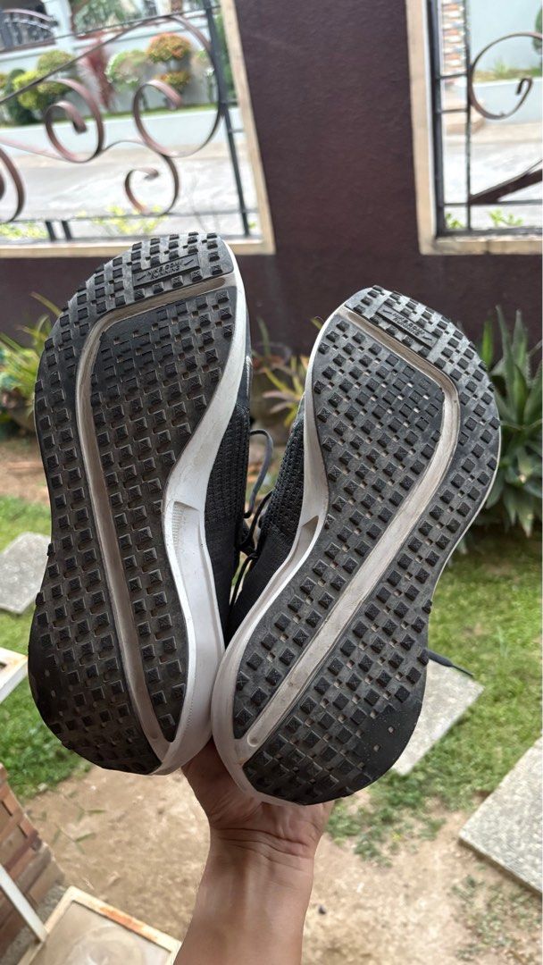 Nike Interact Run (Category: Sneakers) located in Orion. Submitted by reddotitems (Listing ID 1423174506, Image 1). Description: USED FOR 147km, hence the rugged outsole. Bought on January 16 for Bataan grand run for 2699 - Dark grey upper with white midsole - Visible Nike logo - Shows wear on soles - Laced design - Breathable construction - Unique tread pattern for grip.