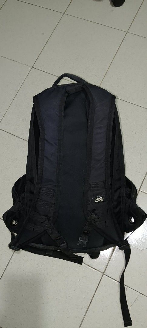 Nike SB Backpack Black (Category: Backpacks) located in Las Pinas. Submitted by reyreyforo80065 (Listing ID 1423134022, Image 2). Description: - Black Nike SB backpack - Main compartment with mesh pocket - Smaller front pocket - Adjustable shoulder straps - Top handle - Nike SB logo visible - Durable material.