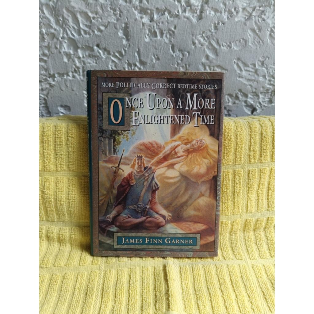 Once Upon a More Enlightened Time Book (pre loved / hardbound) (Category: Storybooks) located in Paranaque City. Submitted by goddess_to_goodies (Listing ID 1423189509, Image 1). Description: - Title: 'Once Upon a More Enlightened Time' - Author: James Finn Garner - Part of the 'More Politically Correct Bedtime Stories' series - Cover Illustration: King and woman - Condition: Good.
