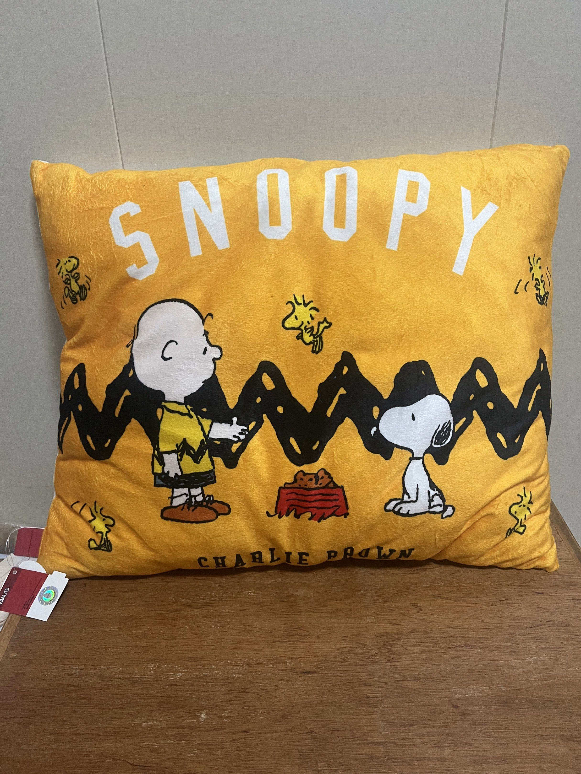 Peanuts Snoopy Pillow (Category: Plushies & Soft Toys) located in Las Pinas. Submitted by stuffhaven (Listing ID 1423107969, Image 1). Description: Location : Las Piñas Pick up or lalamove. -Pillow features Snoopy and Charlie Brown -One side has a yellow background with "Snoopy" printed on it. The other side has a white background with "Peanuts Since 1950" printed on it. -The pillow has a tag attached. -There is a small stain/dirt on the white si