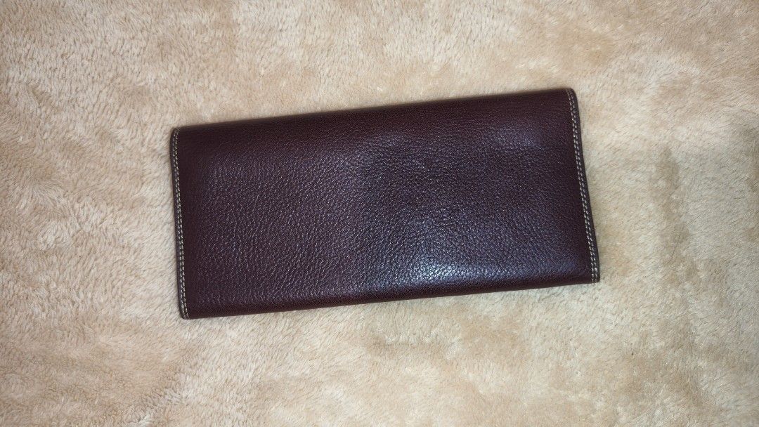Playboy Brown Leather Wallet (Category: Wallets & Card holders) located in Tanza. Submitted by declutterolshoppe (Listing ID 1423168183, Image 2). Description: - Playboy brown leather wallet - Multiple card slots - Compartments for bills and essentials - Snap closure - Playboy logo on front and inside - Visible stitching - Classic and functional design.