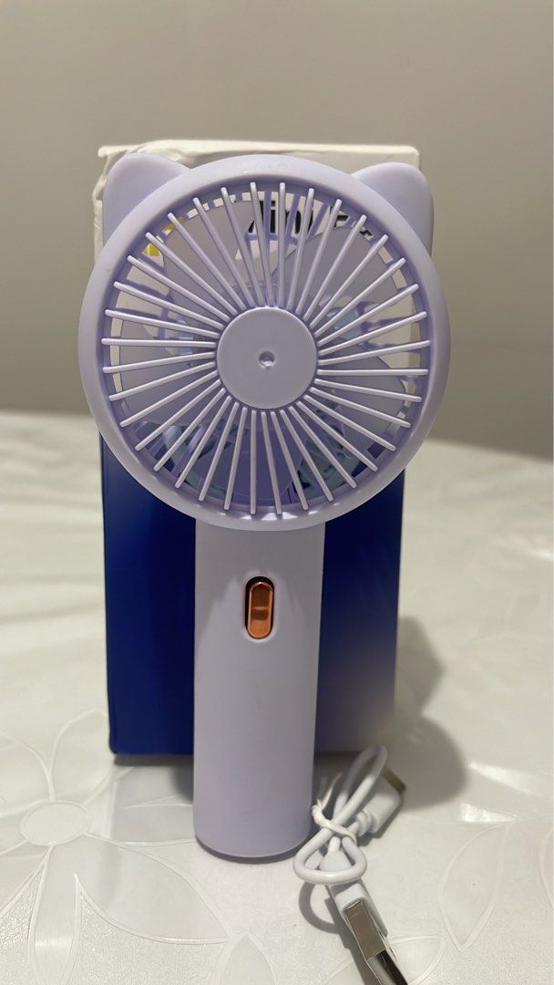 Portable Cute Fan / Handheld Purple Fan (Category: Other Gadgets) located in Las Pinas. Submitted by nsp2014264 (Listing ID 1423187213, Image 2). Description: Portable fan / Mini Handheld fan.