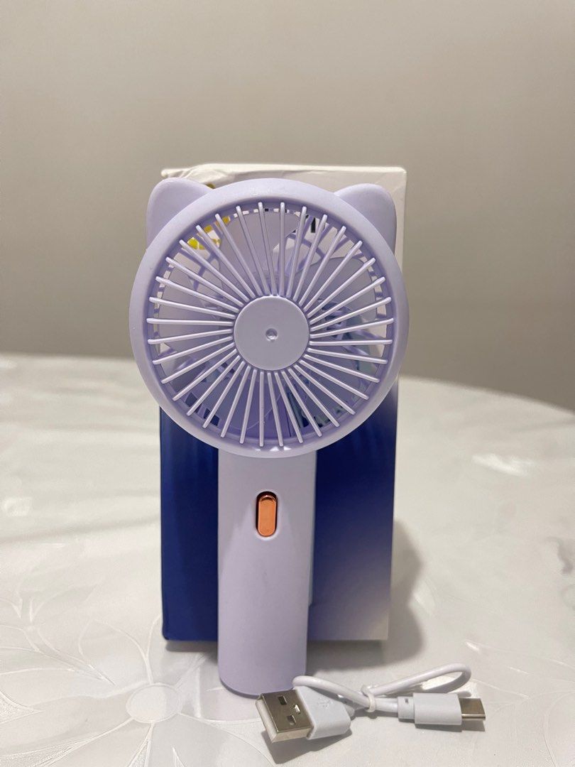 Portable Cute Fan / Handheld Purple Fan (Category: Other Gadgets) located in Las Pinas. Submitted by nsp2014264 (Listing ID 1423187213, Image 1). Description: Portable fan / Mini Handheld fan.