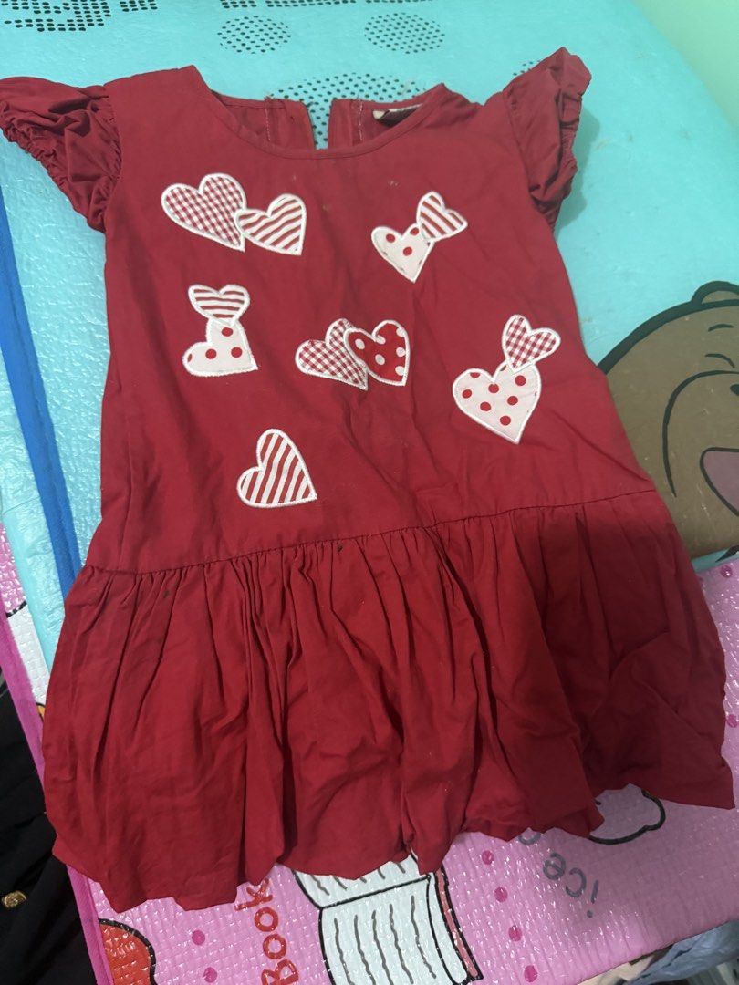 Red Heart Applique Dress (Category: Babies & Kids Fashion) located in Makati City. Submitted by tuffbrat (Listing ID 1423219245, Image 1). Description: - Adorable red dress (size 3Y) - Features heart appliques - Round neckline - Short sleeves with ruffled details - Playful gathered skirt - Comfortable fabric - Easy to wear and care for - Ideal for everyday wear or special occasions.