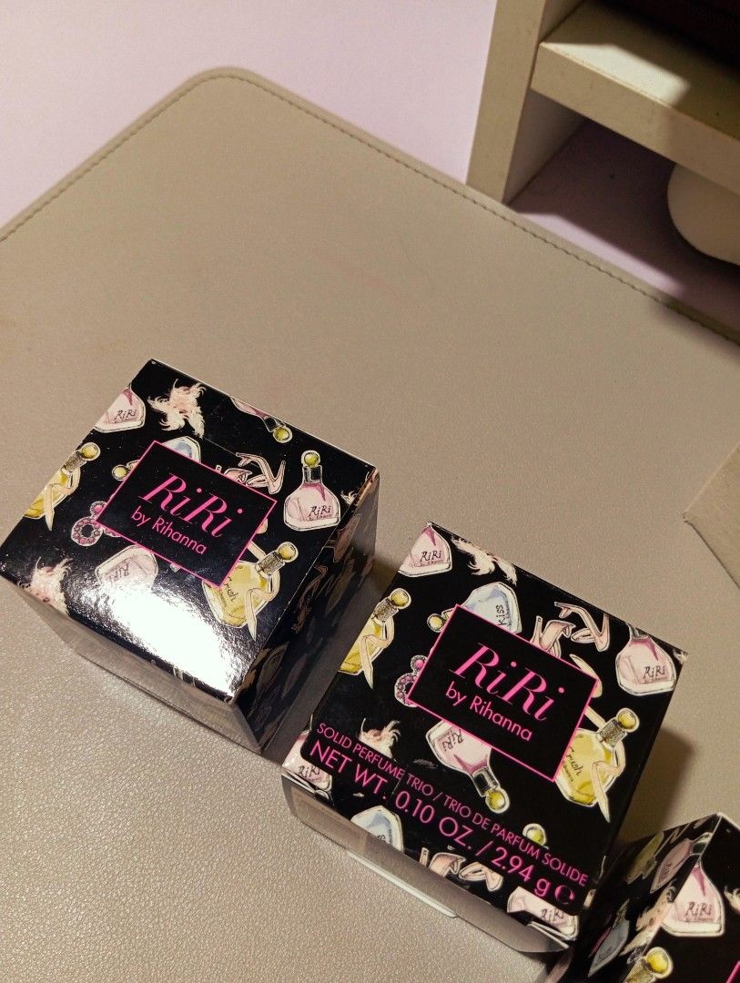 RiRi by Rihanna Solid Perfume Trio (Category: Fragrance & Deodorants) located in Cavite. Submitted by aether-elementph_11 (Listing ID 1423249702, Image 2). Description: Rihanna Solid Perfume Balms Each Box Contain 3pcs of Rihanna's RiRi Perfume Line Includes: Riri By Rihanna , Kiss By Rihanna , and Crush By Rihanna. Bought in Italy 🇮🇹 Extremely Rare/Discountinued Scent From Rihanna All Sealed and Brand New It Smells Absolutely Divine and Dreamy