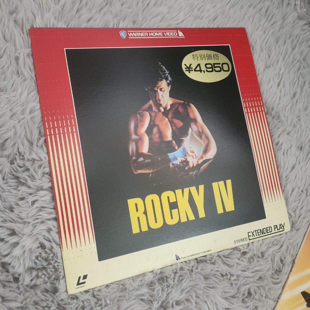 Rocky IV & Top Gun Laserdiscs (Category: CDs & DVDs) located in Manila. Submitted by racz03 (Listing ID 1423083852, Image 3). Description: - Two laserdiscs for sale: "Rocky IV" and "Top Gun". - "Rocky IV" has a price tag of ¥4,950. - Both discs are in their original packaging. - "Top Gun" features Tom Cruise and Kelly McGillis. Both In Nearmint to Mint Condition, No Scratches. price is For Both Item.