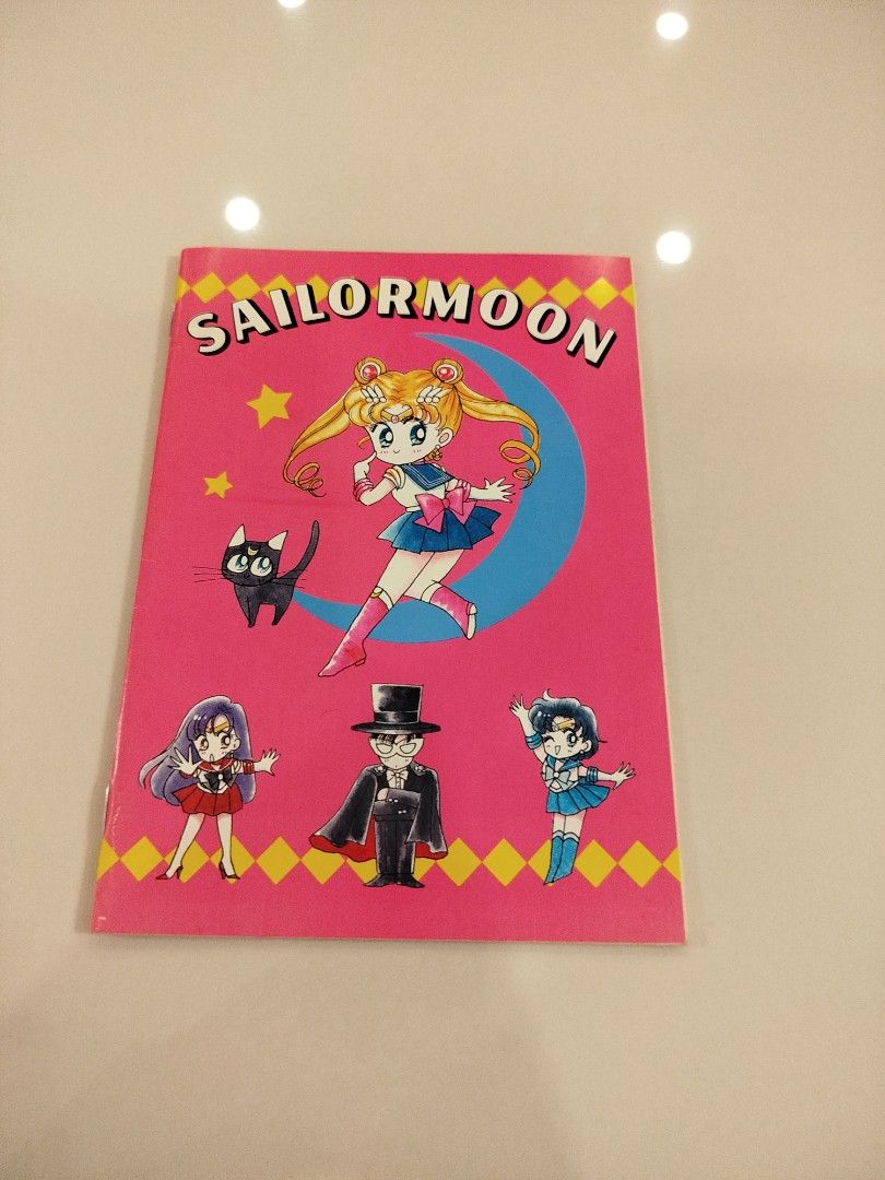 Sailor Moon Notebook (Category: Stationery & School Supplies) located in Caloocan City. Submitted by toys_r_here (Listing ID 1423201523, Image 1). Description: - Vintage Sailor Moon notebook - Features Sailor Moon and other characters - Pink cover with Sailor Moon graphics - Lined pages - Sailor Moon character illustrations at the bottom of pages - From the 90s.