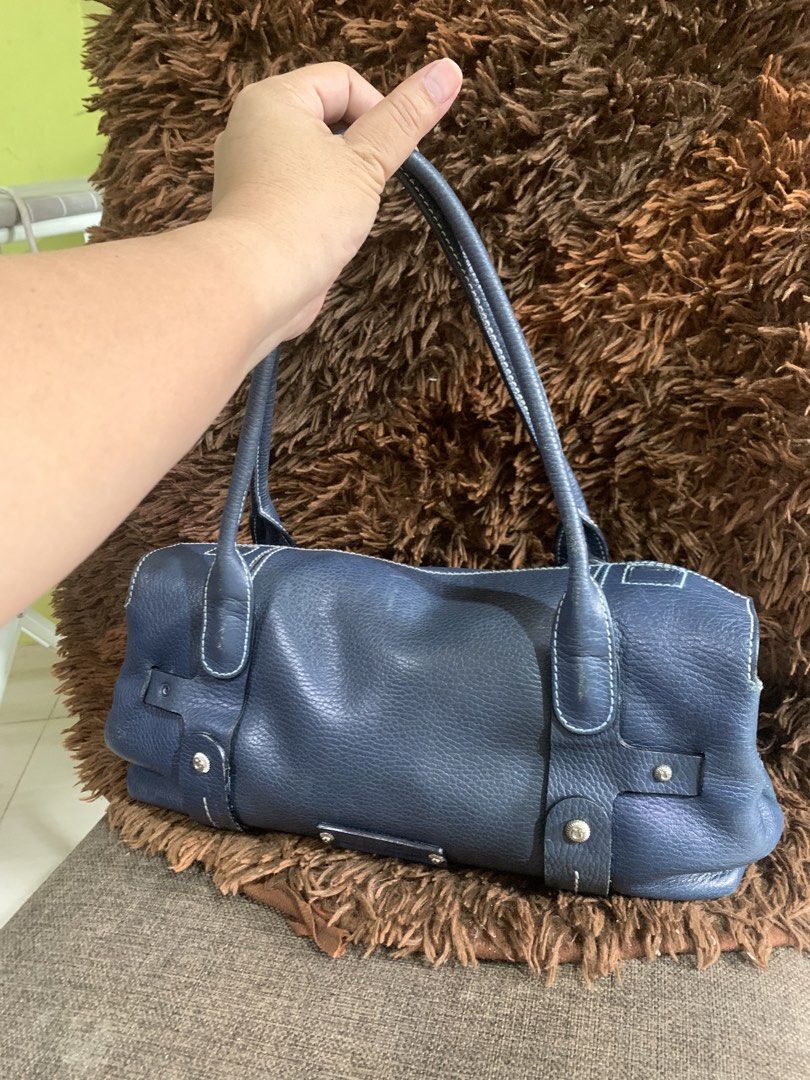 Salvatore Ferragamo Blue Leather Handbag (Category: Luxury Bags & Wallets) located in Liloan. Submitted by jinalyns (Listing ID 1423117265, Image 2). Description: - Salvatore Ferragamo handbag - Elegant blue leather - Structured design - Top handles - White stitching details - Zipper closure - Fabric lining - Branded metal plate - Rectangular shape - High-quality leather.