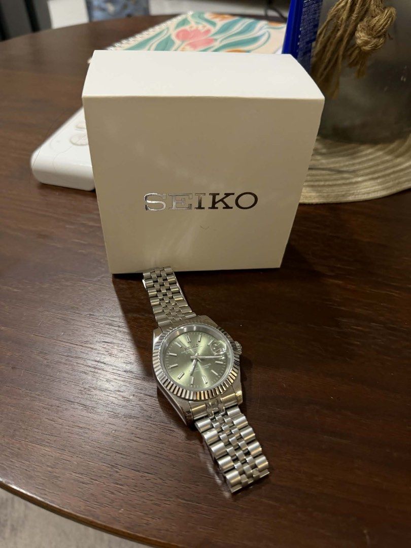 Seiko Oyster Perpetual Datejust Watch (Category: Luxury Watches) located in Marikina City. Submitted by jbisonpaz (Listing ID 1423204222, Image 1). Description: - Seiko Datejust watch - Silver stainless steel strap - Stunning green dial - Fluted bezel - Date display - Comes with box QC area.