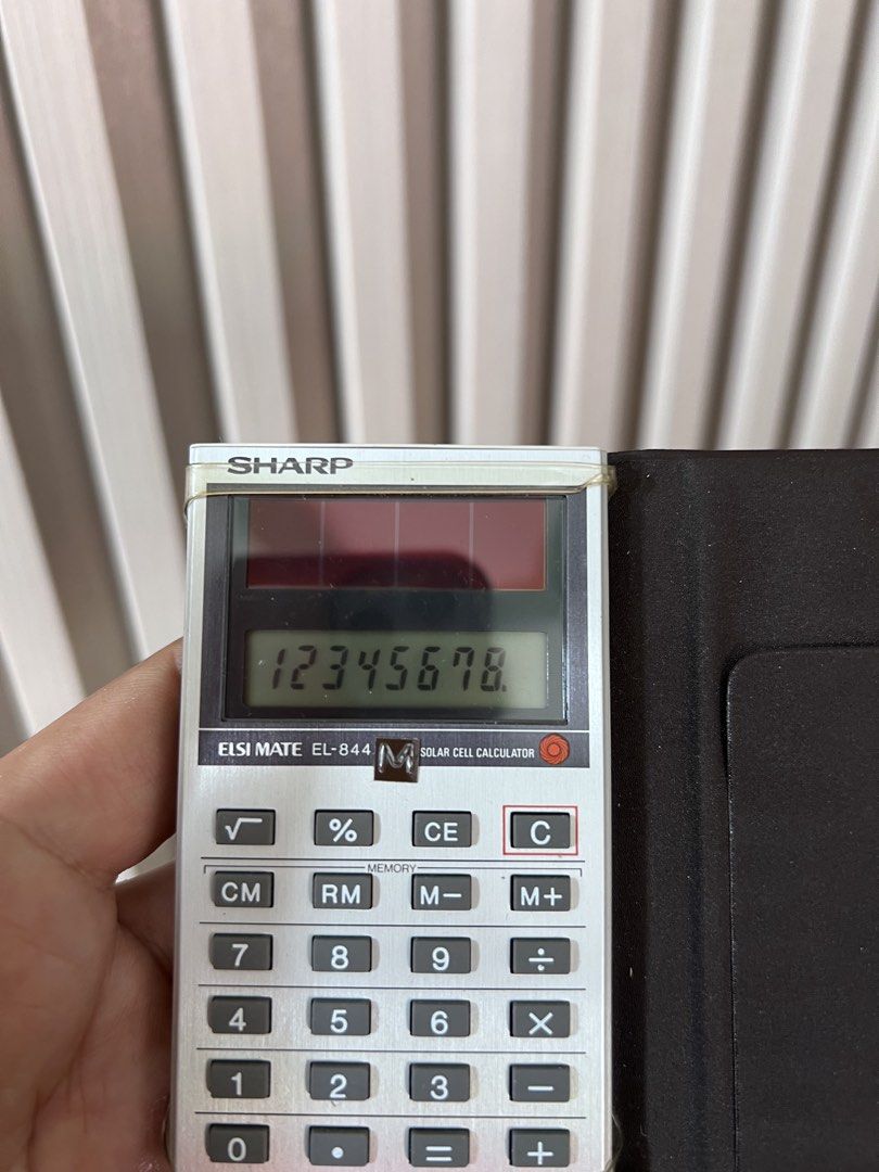 Sharp ELSI MATE EL-844 Calculator (Category: Office & Business Technology) located in Zamboanga. Submitted by lcomprendio26013 (Listing ID 1423131916, Image 3). Description: - Vintage Sharp ELSI MATE EL-844 calculator - Solar-powered - Includes original case - Features basic arithmetic functions - Display shows numbers - In working condition Price 230.