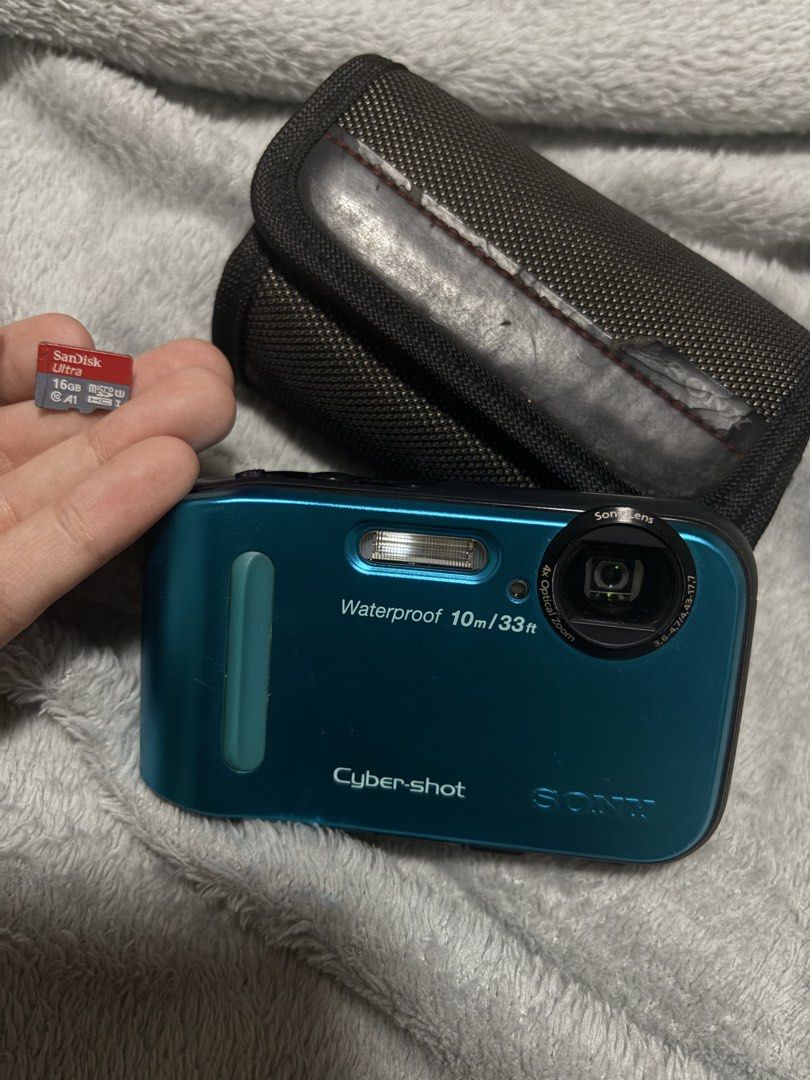 Sony Cybershot DSC-TF1 Waterproof Camera (Category: Cameras) located in Las Pinas. Submitted by niclothes_ (Listing ID 1423177643, Image 2). Description: Sony Cyber-shot DSC-TF1 digital camera (blue) - cosmetics: 9/10 pwedeng pwede sa maarte (may maliit lang na scratch sa screen; photo 3) - Waterproof up to 10m/33ft - Includes 16GB SanDisk Ultra SD card - Includes carrying case - 16.1 megapixel sensor - Built-in flash - Features screen for photo/