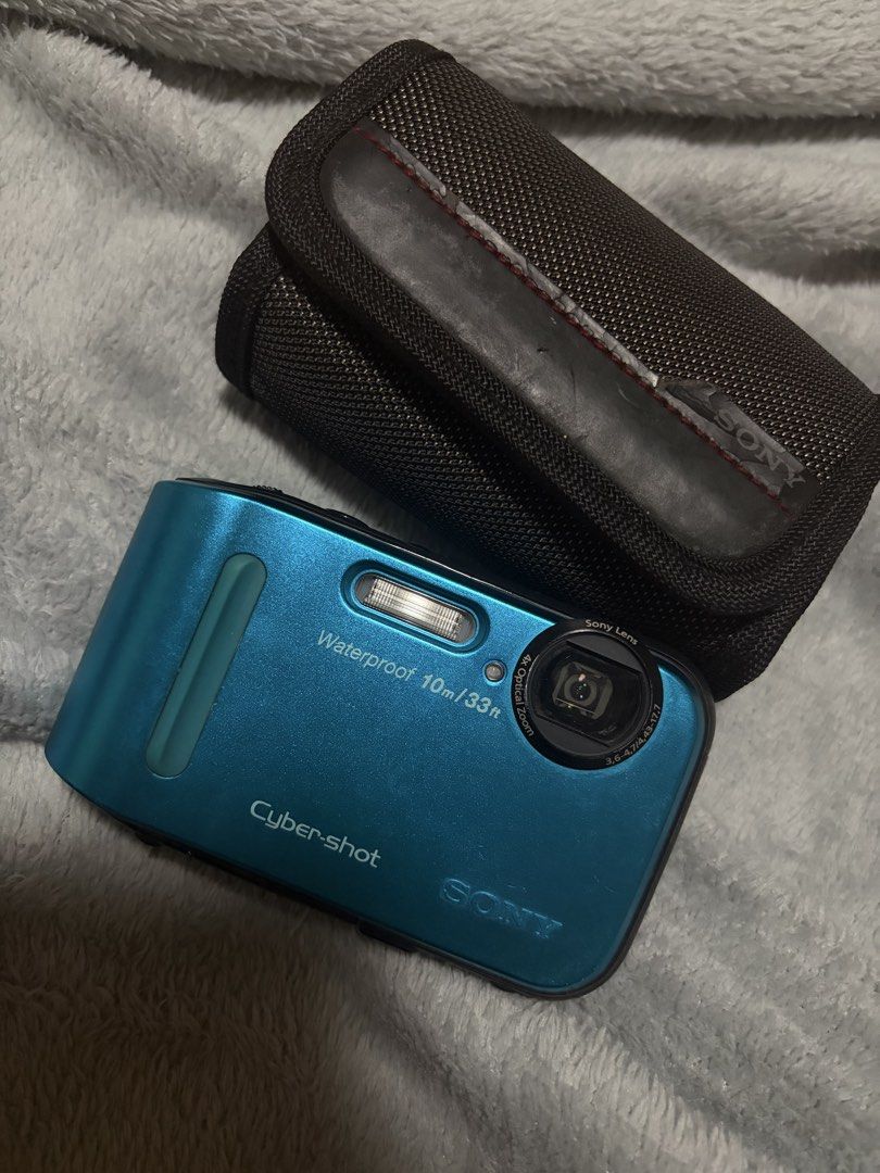 Sony Cybershot DSC-TF1 Waterproof Camera (Category: Cameras) located in Las Pinas. Submitted by niclothes_ (Listing ID 1423177643, Image 1). Description: Sony Cyber-shot DSC-TF1 digital camera (blue) - cosmetics: 9/10 pwedeng pwede sa maarte (may maliit lang na scratch sa screen; photo 3) - Waterproof up to 10m/33ft - Includes 16GB SanDisk Ultra SD card - Includes carrying case - 16.1 megapixel sensor - Built-in flash - Features screen for photo/