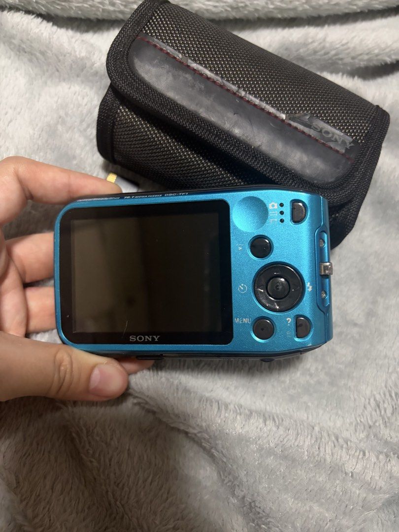 Sony Cybershot DSC-TF1 Waterproof Camera (Category: Cameras) located in Las Pinas. Submitted by niclothes_ (Listing ID 1423177643, Image 3). Description: Sony Cyber-shot DSC-TF1 digital camera (blue) - cosmetics: 9/10 pwedeng pwede sa maarte (may maliit lang na scratch sa screen; photo 3) - Waterproof up to 10m/33ft - Includes 16GB SanDisk Ultra SD card - Includes carrying case - 16.1 megapixel sensor - Built-in flash - Features screen for photo/