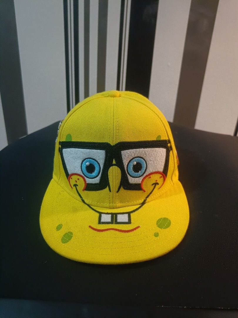 Spongebob Squarepants Cap (Category: Caps & Hats) located in Manila. Submitted by johnangelo38787 (Listing ID 1423128218, Image 1). Description: - Yellow cap with Spongebob Squarepants design - Features Spongebob's face with glasses and smile - Made of sturdy fabric - Curved brim - Perfect for Spongebob fans!.