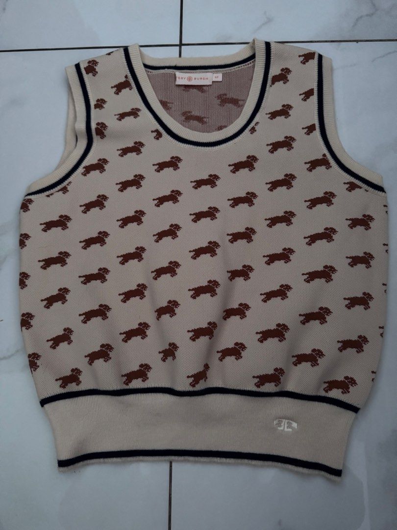 Tory Burch Dog Print Vest (Category: Vests) located in Manila. Submitted by decluterthings888 (Listing ID 1423105605, Image 1). Description: - Tory Burch vest - Adorable dog print - Size: S/P - Color: Cream and brown - Sleeveless design - Round neckline - Ribbed hem - Features the Tory Burch logo.