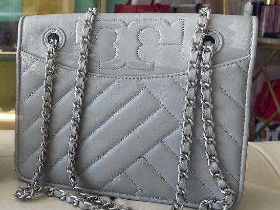 Tory Burch Kira Chevron Bag (Category: Luxury Bags & Wallets) located in Manila. Submitted by alyshop.25 (Listing ID 1423126154, Image 1). Description: - Tory Burch Kira Chevron Bag: - Color: Light Gray - Features: Chain strap - Marc Jacobs Handbag: - Color: Lavender - Features: Top handle, zipper closure - Condition: Good - Perfect for everyday use or special occasions..