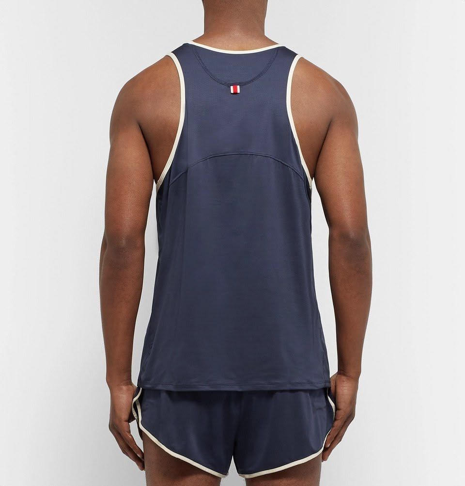 Tracksmith Twilight Tank - Navy/Ivory (Category: Activewear) located in Makati City. Submitted by raceday.rdy (Listing ID 1423221699, Image 3). Description: Tracksmith's super lightweight and silky-soft mesh tank designed for summer months Large, see garment measurements in the last pic Excellent used condition Color: Navy with Ivory piping.
