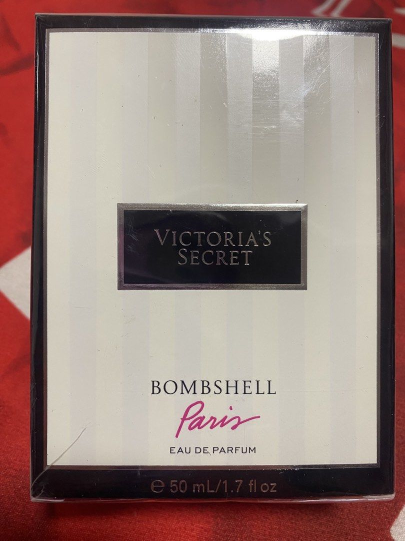Victoria's Secret Bombshell Paris Eau de Parfum (Category: Fragrance & Deodorants) located in Makati City. Submitted by iluvpurple17 (Listing ID 1423204600, Image 1). Description: - Victoria's Secret Bombshell Paris Eau de Parfum - Size: 50 ml / 1.7 fl oz - Features a white and black box design - 'Bombshell Paris' in pink lettering - Eau de Parfum.