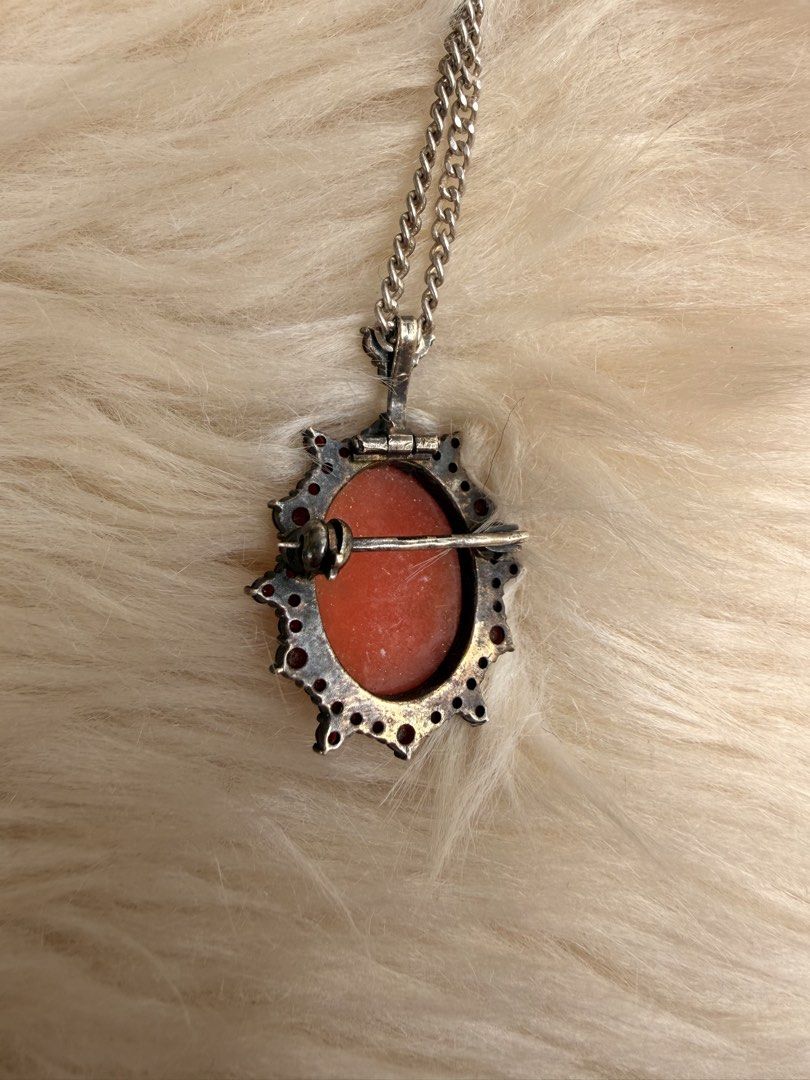 Vintage Cameo Pendant Necklace (Category: Necklaces) located in Manila. Submitted by santabhe (Listing ID 1423083029, Image 2). Description: FOR SALE: Mom’s Vintage Cameo Necklace 🐚✨ Price: ₱3,000 Condition: Pre-loved / Well-maintained Elegant and timeless piece from my mom’s personal collection. Perfect for vintage lovers! FEATURES: • Classic Design: Detailed carved silhouette (Cameo). • Accents: Surrounded by deep red stones (Victorian vibe). 